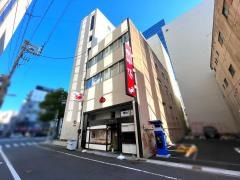 かに通